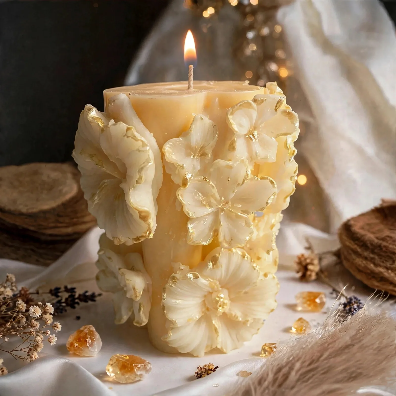 Sculpted Floral Pillar Candle – Coconut Soy — lit with a warm flame